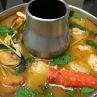 17. Poh Tak Soup · Delicious blend of lemongrass, kaffir lime leaves and galangal roots with shrimp, scallop, s...