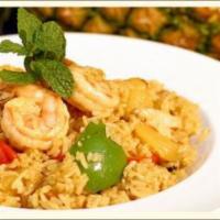 53. Pineapple Fried Rice · Stir-fried rice with pineapple, raisins, onions, bell peppers, cashew nuts and yellow curry ...