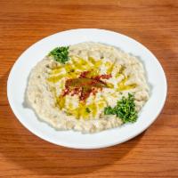 Baba Ganoush · Chargrilled eggplant blended with tahini sauce, lemon juice, and minced garlic. Served with ...
