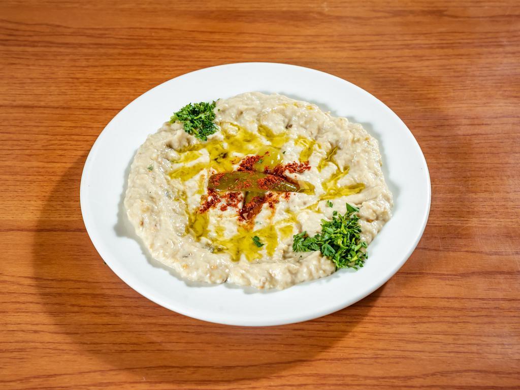 Baba Ganoush · Chargrilled eggplant blended with tahini sauce, lemon juice, and minced garlic. Served with warm pita bread.