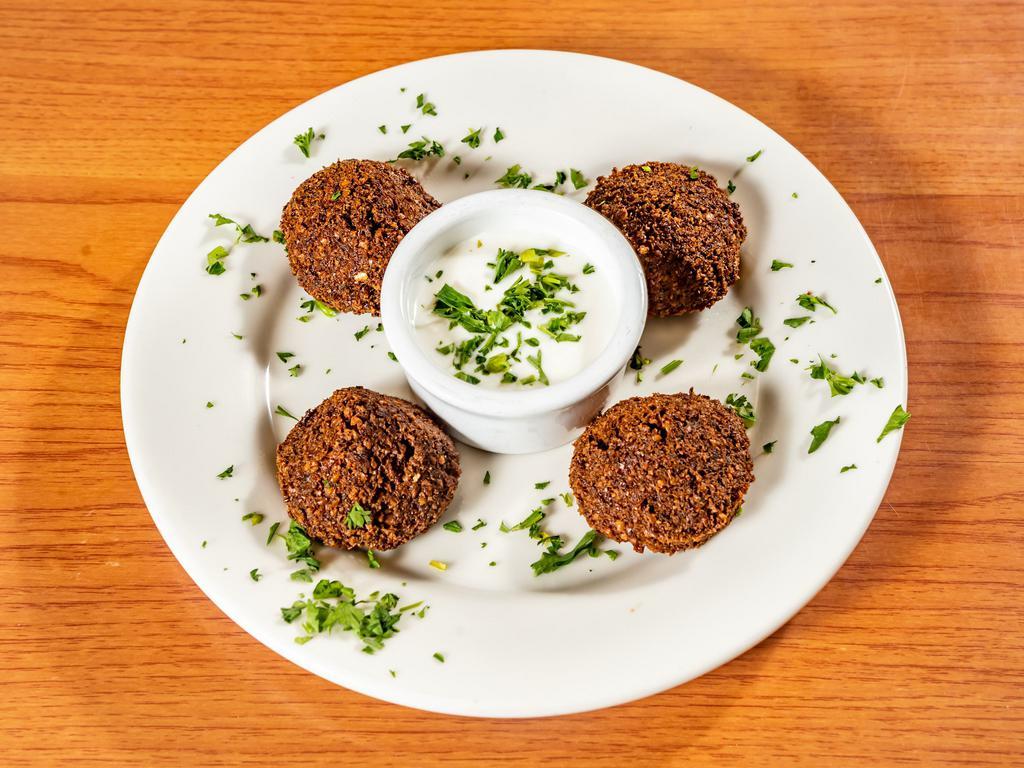 Falafel · Fresh ground chickpeas with herbs and spices, fried until golden brown and served with special tahini mix.