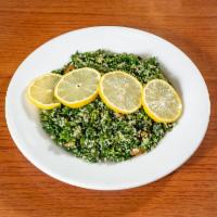 Tabouli Salad · Finely chopped parsley, diced cucumbers and tomatoes mixed with burghul. Seasoned with lemon...