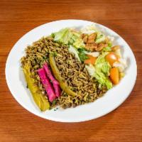 M’jadara · Brown lentils cooked with rice, diced onions, olive oil. Served with a fattoush salad and pi...