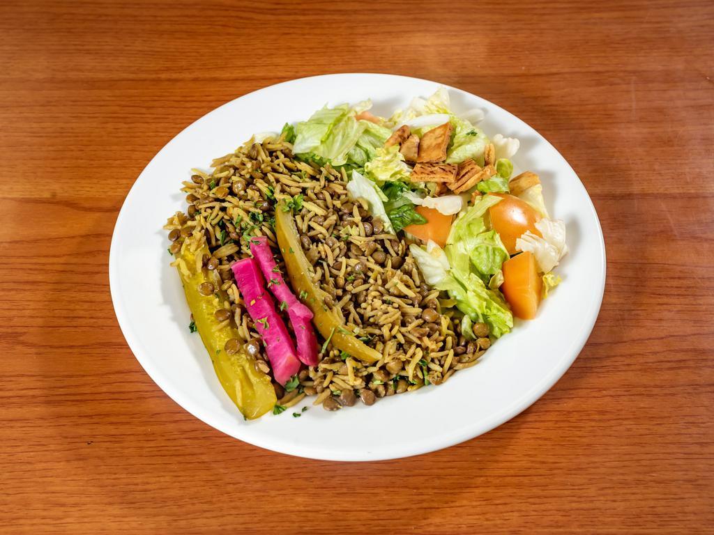 M’jadara · Brown lentils cooked with rice, diced onions, olive oil. Served with a fattoush salad and pickles.