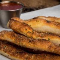 Breadsticks · Handcrafted using our fresh baked dough, sliced into approximately 10 pieces, topped with wh...