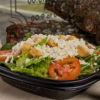 House Side Salad · Romaine lettuce, Roma tomatoes, whole milk mozzarella, seasoned croutons, served with your c...