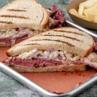 Pastrami Sloppy Joe · Our house smoked Pastrami with Swiss Cheese, Coleslaw and Russian dressing on Rye.  Served w...
