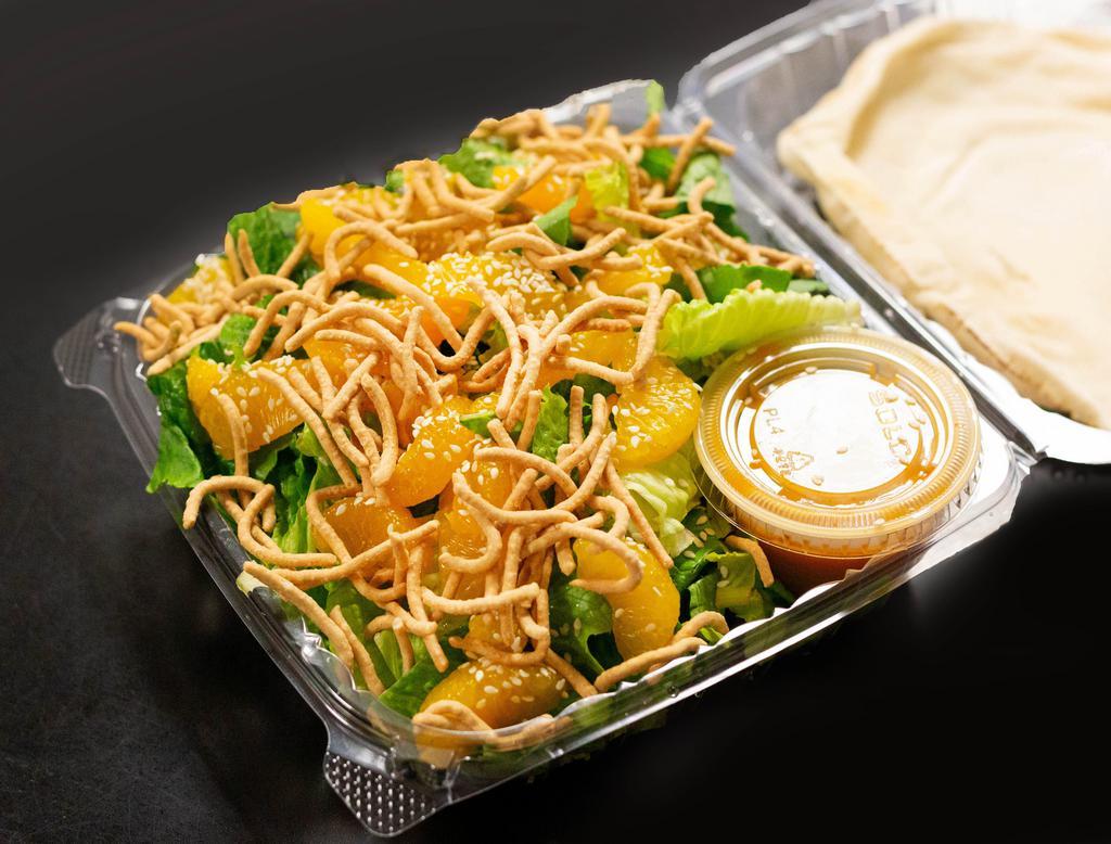 Mandarin Orange Asian Salad · A bed of crisp romaine lettuce topped with sesame seeds, wedges of sweet mandarin orange, and crunchy Asian noodles served with our mandarin orange sesame ginger dressing. Served with pita bread. 