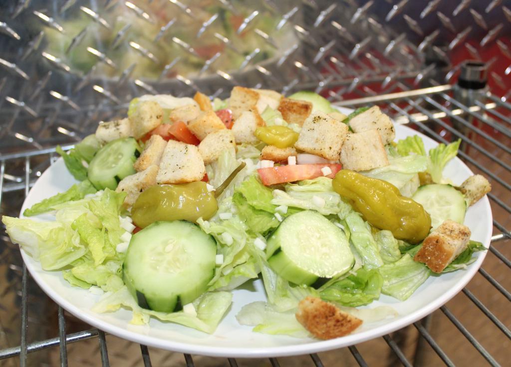 House Salad · Mixture of Romaine and Iceberg lettuce, tomatoes, cucumber, pepperoncini, mozzarella & croutons with your choice of dressing.