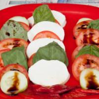 Caprese Salad · Fresh buffalo mozzarella with tomatoes, roasted red peppers and cucumbers in balsamic vinaig...