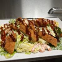 Southwest BBQ Chicken Salad · Mixture of Romaine and Iceberg lettuce, crispy chicken, tomatoes, mozzarella cheese, BBQ sau...