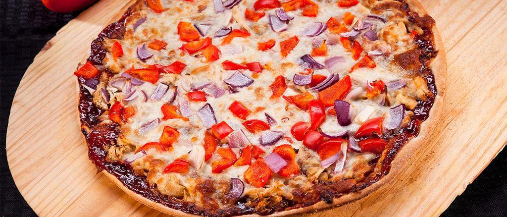 Thin Crust BBQ Chicken Pizza · BBQ sauce, chicken, red bell peppers, fresh garlic and red onions.