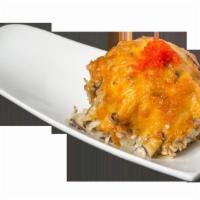 Volcano Maki · Spicy tuna maki topped with a torched scallop, tobiko, scallion, crab meat and mushroom mixt...