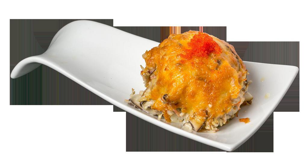 Volcano Maki · Spicy tuna maki topped with a torched scallop tobiko scallion crab meat and mushroom mixture.