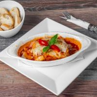 Lasagna Bolognese · Beef lasagna with fresh tomato sauce and Parmesan cheese.