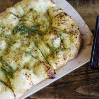 Garlic Bread · Flatbread dough, pesto, garlic & marinara.