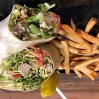 Chick'n Caesar Wrap · Grilled Chick'n, Crisp Romaine, Cherry Tomatoes, Parmesan, Caesar Dressing all wrapped in a ...
