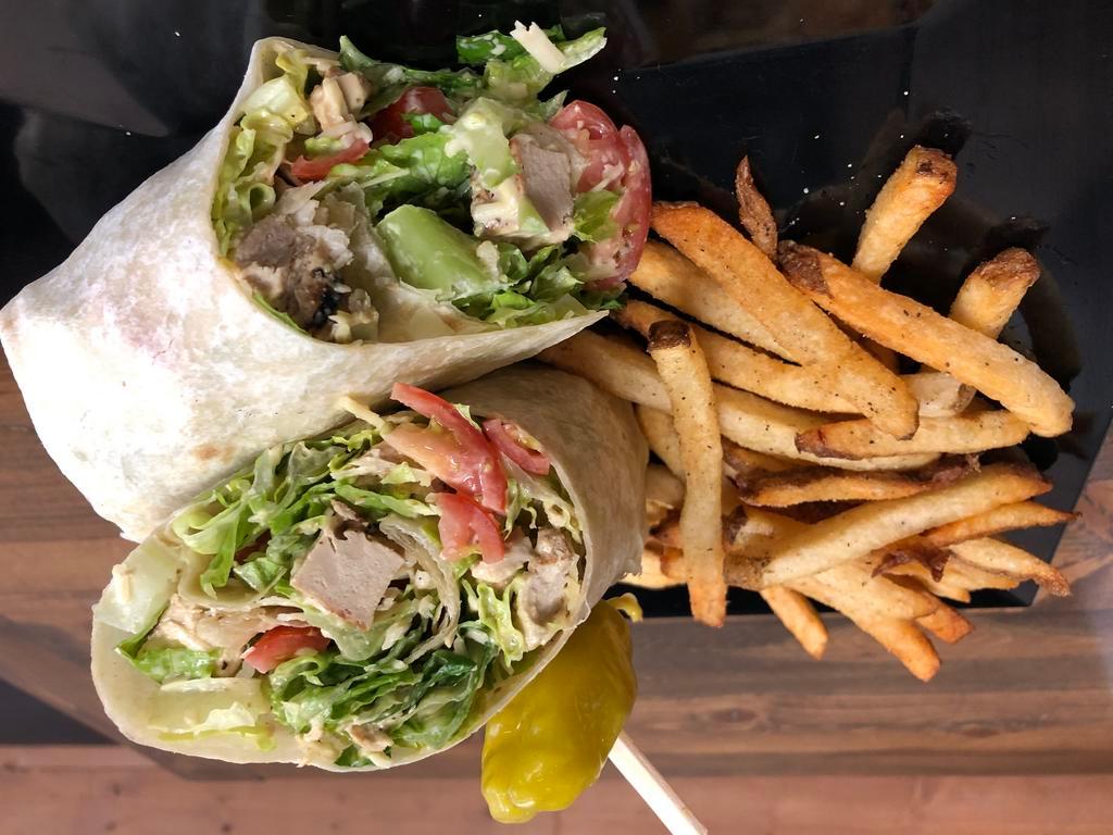 Chick'n Caesar Wrap · Grilled Chick'n, Crisp Romaine, Cherry Tomatoes, Parmesan, Caesar Dressing all wrapped in a tortilla