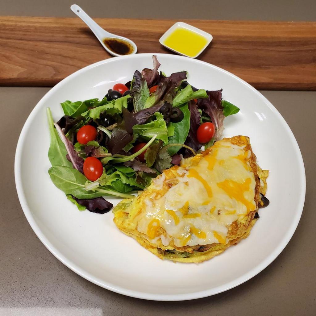 Garden Omelet · Onion, bell peppers, mushrooms, spinach, mix cheese, and hash-brown
your choice of white or wheat toast