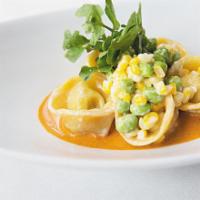 Seafood Tortellini · Served with lobster sauce, sauteed corn and edamame.