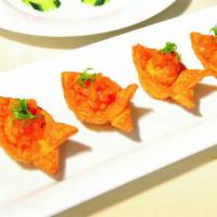Sun-Dried Tomato and Puna Goat Cheese Wontons · Served with pineapple chutney.