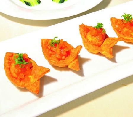 Sun-Dried Tomato and Puna Goat Cheese Wontons · Served with pineapple chutney.