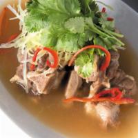 Thai-Style Oxtail Soup · Served with spicy lemongrass broth and Chinese celery. Rich beef broth like no other. Full-f...