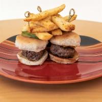 Beef Sliders · 3 beef patties with melted American cheese on a brioche bun topped with pickles and cherry t...