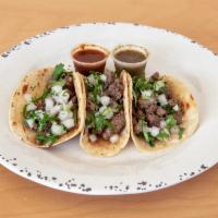 3 Tacos Plate · 3 traditional tacos served in a white corn tortilla with your choice of carnitas, asada, chi...
