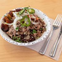 El Cubano Bowl · Our roasted pork served on a bed of rice beans and fried sweet plantains garnished with fres...