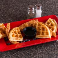 Chicken and Waffles · Hand battered chicken tenders over a fluffy homemade waffle with your choice of regular or h...