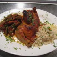 Half Roasted Chicken · In tomato sauce with string beans and rice.