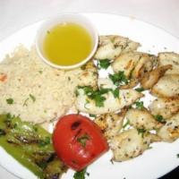 Grilled Calamari · Served with rice and grilled vegetables.