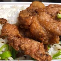 Salted Peppercorn Pork Chop on Rice · Fried pork chops with spicy peppers
