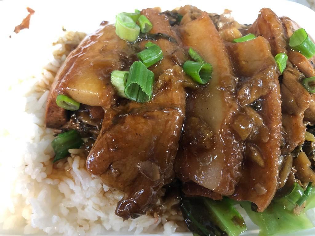 Braised Pork Belly on Rice · First seared, then fried, then braised for 3 hours. Fatty pork belly with pickled cabbage. 