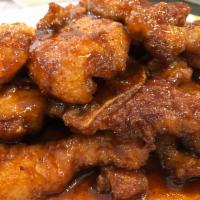 Peking Style Style Chops · Sweet and sour saucy fried pork chops 