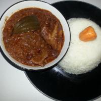 Lamb Mafe · Creamy peanut butter stew with lamb and tomato, cooked vegetables, served with white jasmine...