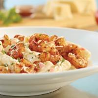 Parmesan Shrimp Pasta · Spicy sauted shrimp over penne in Parmesan cream with tomatoes. Served with 4 Breadsticks.