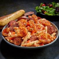 NEW Blackened Shrimp & Sausage Pasta · Penne pasta tossed with a creamy tomato and alfredo sauce and finished with diced tomatoes.