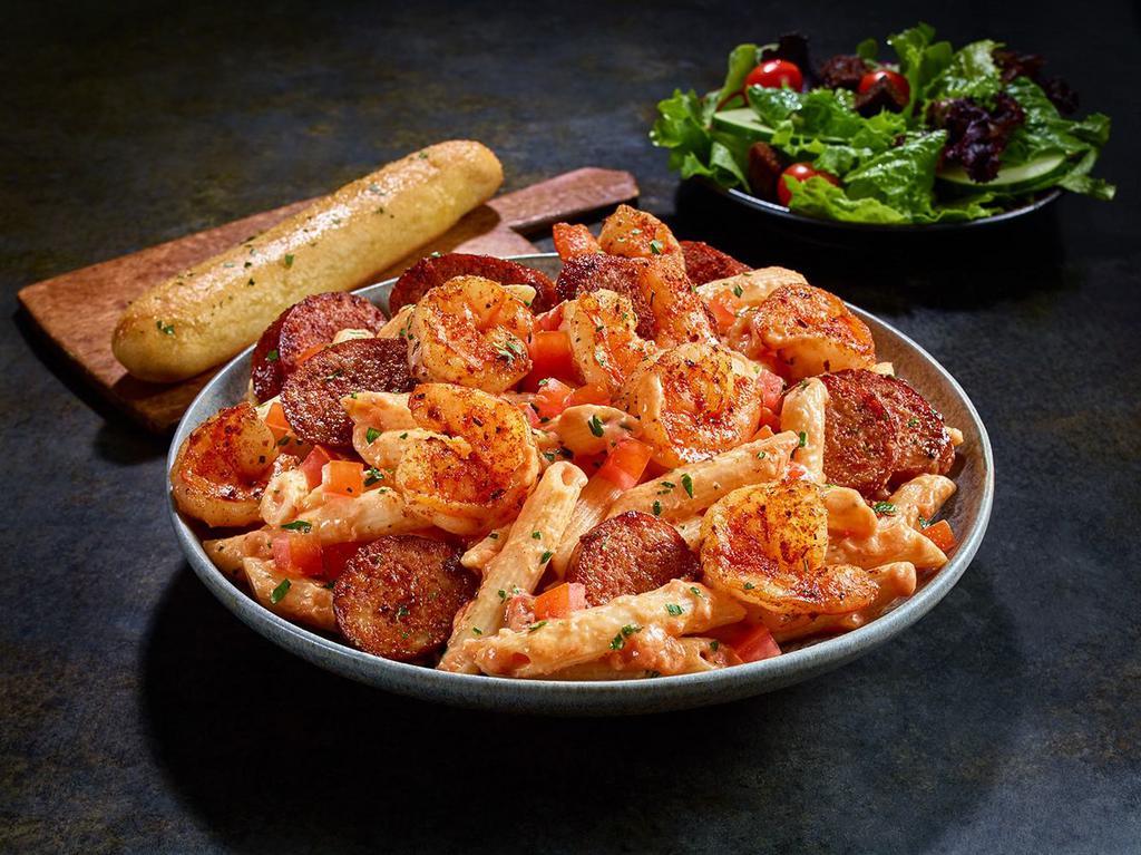 NEW Blackened Shrimp & Sausage Pasta · Penne pasta tossed with a creamy tomato and alfredo sauce and finished with diced tomatoes.