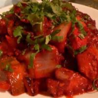 Chili Chicken · Boneless roasted chicken cooked with hot spices,green chilies, tomatoes, vinegar and onions.