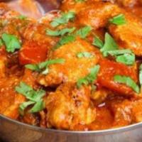 Chicken Madras · Coconut, curry leaves, dry red chilies, comes with rice.