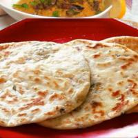 2. Paneer Kulcha · Enriched white flour bread layered with homemade cottage cheese and fresh green coriander.