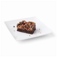Caramel Rockslide Brownie · Layers of chewy brownie and buttery caramel and topped with crunchy toasted pecans.