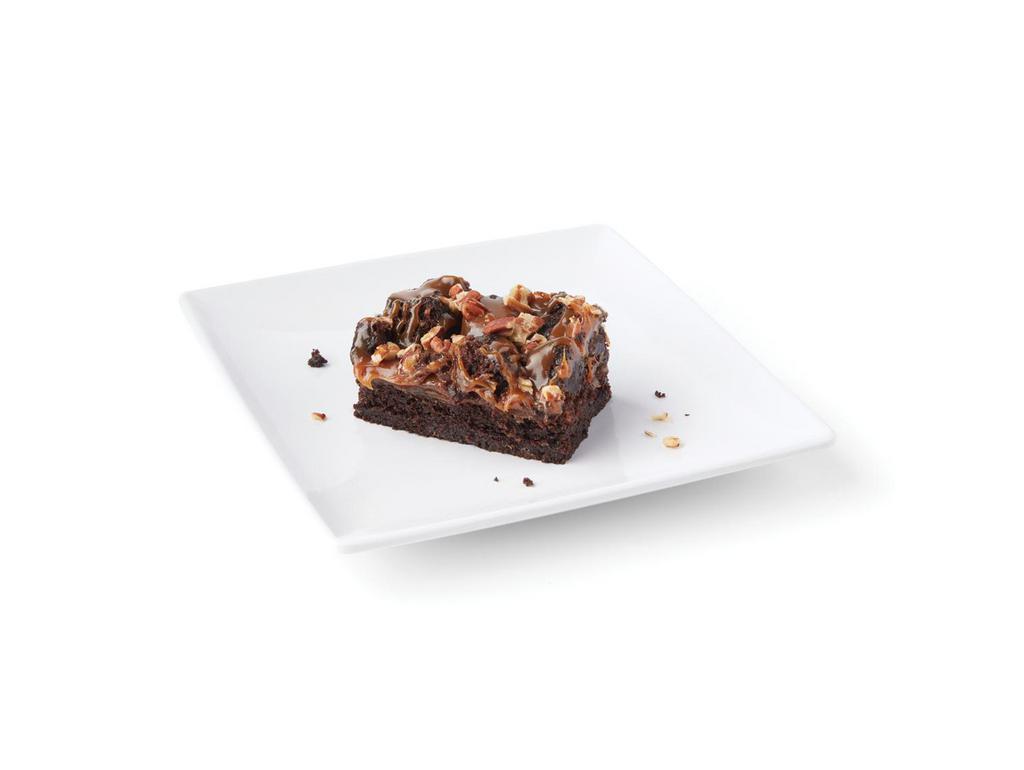 Caramel Rockslide Brownie · Layers of chewy brownie and buttery caramel and topped with crunchy toasted pecans.