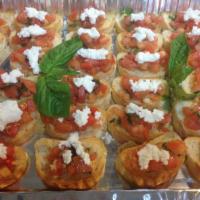 Catering Tomato Bruschetta · Toasted bread topped with homemade mix of diced tomatoes, balsamic vinegar, olive oil, basil...