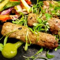 Lamb Seekh Kebab · Skewered minced lamb with basil, peppers, mint oil.