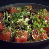 Watermelon Feta Salad · Fresh watermelon ginger mint mixed with greens, quinoa, feta, house chat masala dressing