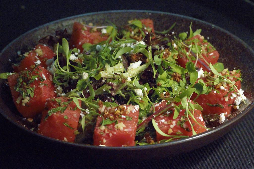 Watermelon Feta Salad · Fresh watermelon ginger mint mixed with greens, quinoa, feta, house chat masala dressing