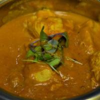 Mango Curry · mango, onion, tomato and coconuI'mt flavored spiced curry